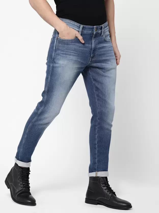 Men Tapered Fit Mid Rise Blue Jeans
